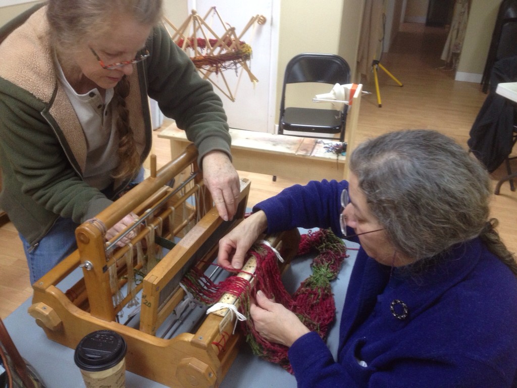 Deb and Denise working together sleying the reed