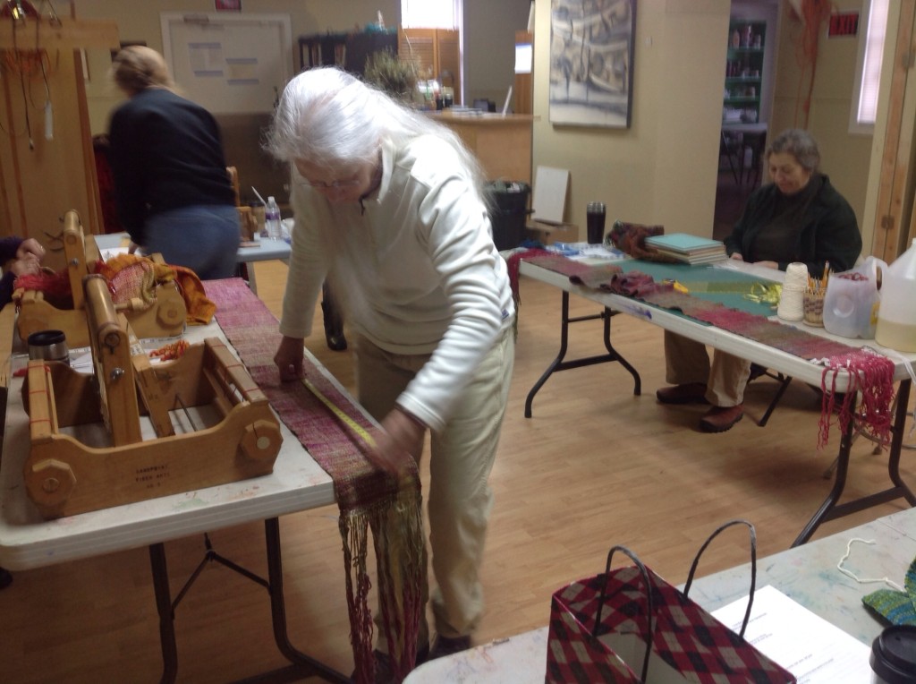 Janet measuring the finished woven scarf before washing